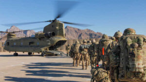 Soldiers attached to the 101st Resolute Support Sustainment Brigade, Iowa National Guard and 10th Mountain, 2-14 Infantry Battalion, load onto a Chinook helicopter to head out on a mission in Afghanistan